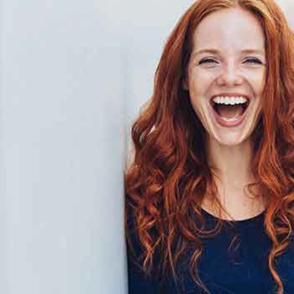 red haired girl smiling